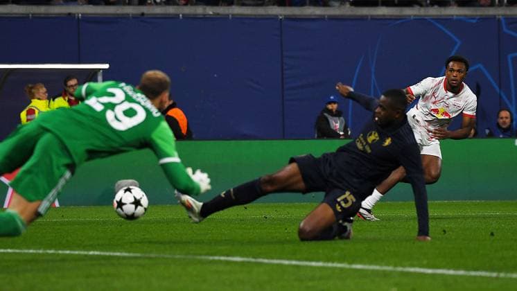 Soccer UEFA Champions League, season 2024 2025, group stage, match day 2, at the match RB Leipzig vs Juventus Turin 02 10 2024 Goal kick Lois Openda center forward RB Leipzig, back number 11, 11 right against Pierre Kalulu center back Juventus Turin, back number 15 center and Michele Di Gregorio goalkeeper Juventus Turin, back number 29 left at the match RB Leipzig vs Juventus Turin 02 10 2024 Leipzig Saxony Germany Red Bull Arena