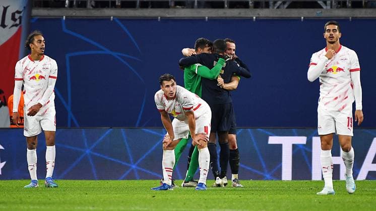 Soccer UEFA Champions League, season 2024 2025, group stage, match day 2, at the match RB Leipzig vs Juventus Turin 02 10 2024 2 3 1 0 final whistle in the match RB Leipzig vs Juventus Turin 02 10 2024 Yussuf Poulsen center forward RB Leipzig, back number 9, 9 left and Willi Orban central defender RB Leipzig, Back number 4, 4 center and Andre Silva center-back RB Leipzig, back number 19, 19 right are disappointed, Mattia Perin goalkeeper Juventus Turin, back number 1 , Pierre Kalulu center-back Juventus Turin, back number 15 celebrate the 3 2 victory Leipzig Saxony Germany Red Bull Arena