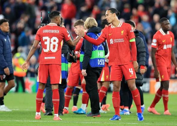2nd October 2024; Anfield, Liverpool, Merseyside, England; Champions League Football, Liverpool versus Bologna; Ryan Gravenberch of Liverpool shakes hands with team mate Virgil van Dijk at full time  ActionPlus12699244 DavidxBlunsden