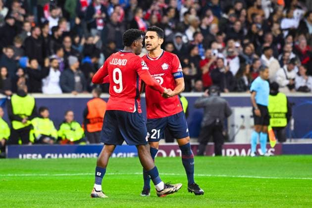 Jonathan David ( 9 - Lille ) celebrates with Benjamin Andre ( 21 - Lille ) during the UEFA Champions League match between Lille OSC and Real Madrid CF at Stade Pierre Mauroy on October 02, 2024 in Lille, France. ( Photo by federico pestellini panoramic ) - FOOTBALL : Lille vs Real Madrid - Ligue des Champions - 02 10 2024 FedericoPestellini Panoramic 