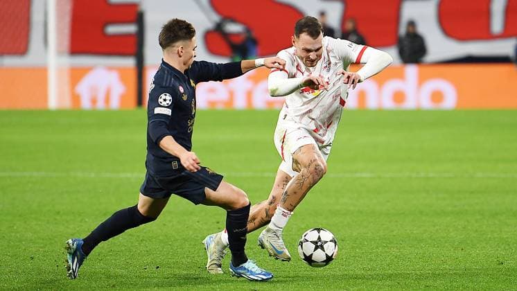 Soccer UEFA Champions League, season 2024 2025, group stage, matchday 2, RB Leipzig vs Juventus Turin 02 10 2024 2 3 1 0 Tackle for the ball between David Raum left defender RB Leipzig, back number 22, 22 right and Francisco Conceiçao right winger Juventus Turin, back number 7 left during the match RB Leipzig vs Juventus Turin 02 10 2024 Leipzig Saxony Germany Red Bull Arena