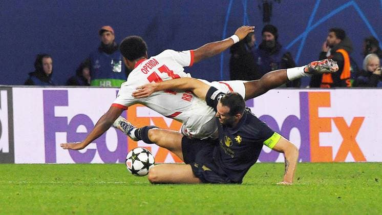 Soccer UEFA Champions League, season 2024 2025, group stage, match day 2, RB Leipzig vs Juventus Turin 02 10 2024 2 3 1 0 duel for the ball between Lois Openda center-back RB Leipzig, back number 11, 11 left and Federico Gatti center-back Juventus Turin, back number 4 right during the match RB Leipzig vs Juventus Turin 02 10 2024 Leipzig Saxony Germany Red Bull Arena