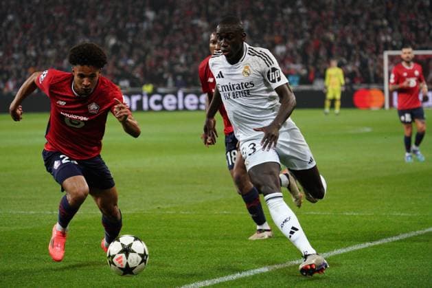 Ferland Mendy of Real Madrid takes on Tiago Santos of Lille Lille v Real Madrid, UEFA Champions League, Group Stage, Football, Pierre Mauroy Stadium, Lille, France, 02 Oct 2024 EDITORIAL USE ONLY No use with unauthorised audio, video, data, fixture lists, club league logos or live services. Online in-match use limited to 120 images, no video emulation. No use in betting, games or single club league player publications. Copyright: xDavexWinter Shutterstockx 14750773gl