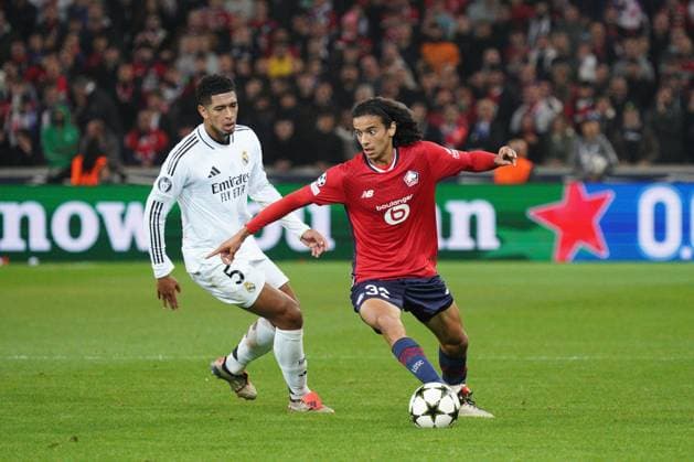 Ayyoub Bouaddi of Lille shields the ball from Jude Bellingham of Real Madrid Lille v Real Madrid, UEFA Champions League, Group Stage, Football, Pierre Mauroy Stadium, Lille, France, 02 Oct 2024 EDITORIAL USE ONLY No use with unauthorised audio, video, data, fixture lists, club league logos or live services. Online in-match use limited to 120 images, no video emulation. No use in betting, games or single club league player publications. Copyright: xDavexWinter Shutterstockx 14750773gj