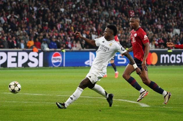 Vinicius Junior of Real Madrid sees his shot saved Lille v Real Madrid, UEFA Champions League, Group Stage, Football, Pierre Mauroy Stadium, Lille, France, 02 Oct 2024 EDITORIAL USE ONLY No use with unauthorised audio, video, data, fixture lists, club league logos or live services. Online in-match use limited to 120 images, no video emulation. No use in betting, games or single club league player publications. Copyright: xDavexWinter Shutterstockx 14750773hg