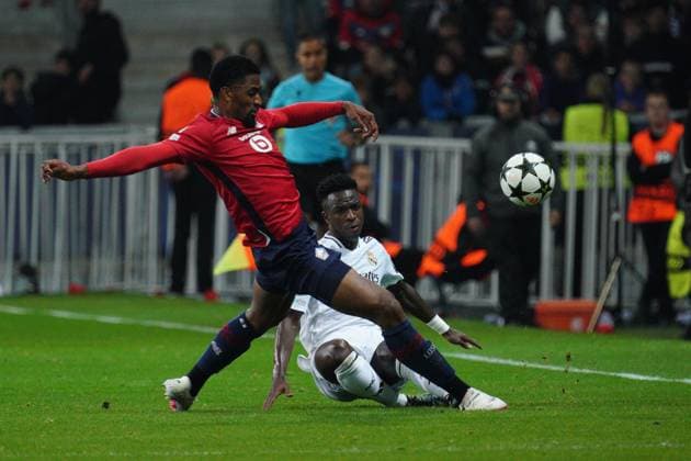 Vinicius Junior of Real Madrid and Alexsandro of Lille Lille v Real Madrid, UEFA Champions League, Group Stage, Football, Pierre Mauroy Stadium, Lille, France, 02 Oct 2024 EDITORIAL USE ONLY No use with unauthorised audio, video, data, fixture lists, club league logos or live services. Online in-match use limited to 120 images, no video emulation. No use in betting, games or single club league player publications. Copyright: xDavexWinter Shutterstockx 14750773gy