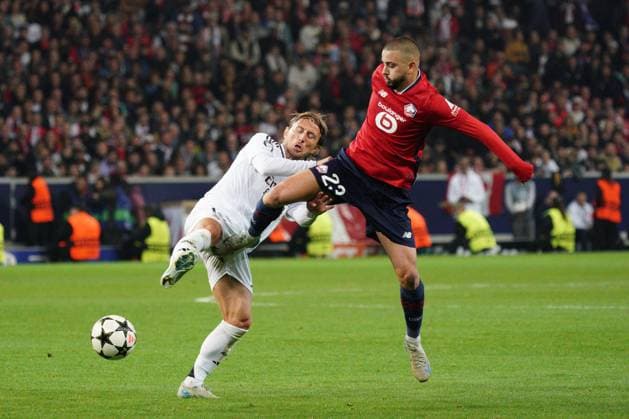 Luka Modric of Real Madrid and Edon Zhegrova of Lille challenge for the ball Lille v Real Madrid, UEFA Champions League, Group Stage, Football, Pierre Mauroy Stadium, Lille, France, 02 Oct 2024 EDITORIAL USE ONLY No use with unauthorised audio, video, data, fixture lists, club league logos or live services. Online in-match use limited to 120 images, no video emulation. No use in betting, games or single club league player publications. Copyright: xDavexWinter Shutterstockx 14750773ld