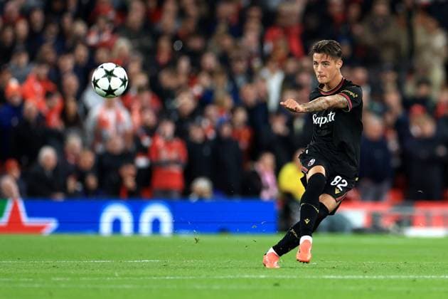 Liverpool, England, 2nd October 2024. Kacper Urbanski of Bologna passes the ball during the UEFA Champions League match at Anfield, Liverpool. Picture credit should read: Jessica Hornby Sportimage EDITORIAL USE ONLY. No use with unauthorised audio, video, data, fixture lists, club league logos or live services. Online in-match use limited to 120 images, no video emulation. No use in betting, games or single club league player publications. SPI-3353-0122