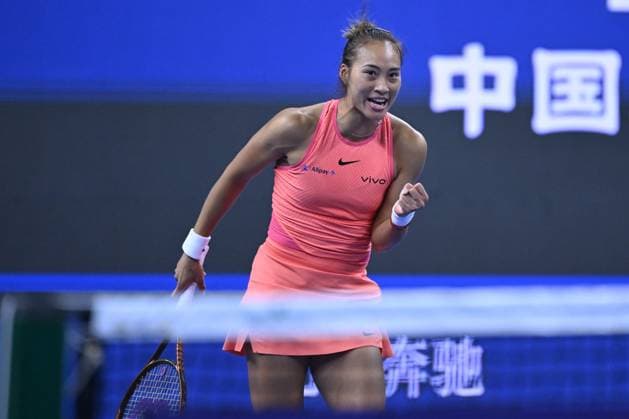 (241003) -- BEIJING, Oct. 3, 2024 -- Zheng Qinwen celebrates winning after the women s singles round of 16 match between Amanda Anisimova of the United States and Zheng Qinwen of China at the 2024 China Open tennis tournament in Beijing, China, Oct. 2, 2024. ) (SP)CHINA-BEIJING-TENNIS-CHINA OPEN-WOMEN S SINGLES(CN) ZhangxLong 