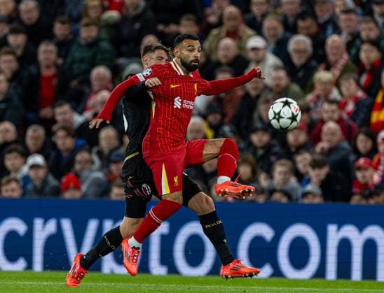 (241003) -- LIVERPOOL, Oct. 3, 2024 -- Liverpool s Mohamed Salah (R) vies for the ball during the second round match of UEFA Champions League between Liverpool FC and Bologna FC in Liverpool, Britain, Oct. 2, 2024. (SP)BRITAIN-LIVERPOOL-UEFA CHAMPIONS LEAGUE-LIVERPOOL VS BOLOGNA LixYing 