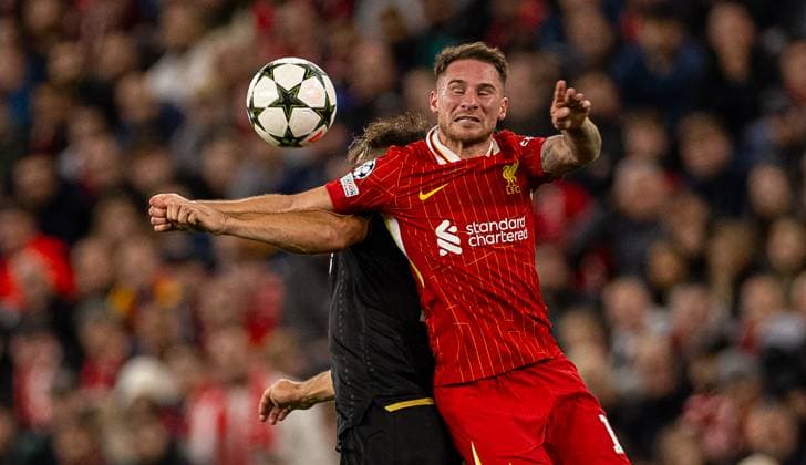 (241003) -- LIVERPOOL, Oct. 3, 2024 -- Liverpool s Alexis Mac Allister (R) vies for a header during the second round match of UEFA Champions League between Liverpool FC and Bologna FC in Liverpool, Britain, Oct. 2, 2024. (SP)BRITAIN-LIVERPOOL-UEFA CHAMPIONS LEAGUE-LIVERPOOL VS BOLOGNA LixYing 
