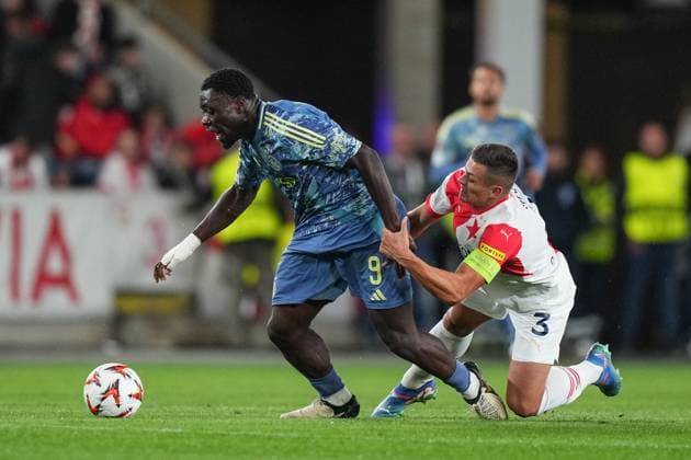 PRAGUE, 03-10-2024 , Eden Arena, football, UEFA Europa League, season 2024 2025, Match between Slavia Praag and Ajax , (L-R) Ajax player Brian Brobbey, Slavia Praag player Tomas Holes Slavia Praag - Ajax  x26382266x Copyright: