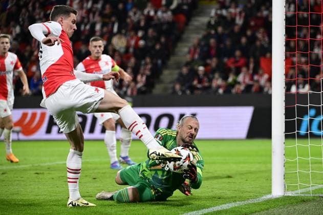 L-R Lukas Provod (Slavia) and goalkeeper Remko Pasveer (Ajax) in action during the Football Europa League 2nd round match SK Slavia Prague vs Ajax Amsterdam in Prague, Czech Republic, October 3, 2024. (CTKxPhoto OndrejxDeml) CTKPhotoP2024100307058  CTKPhotoP2024100307058