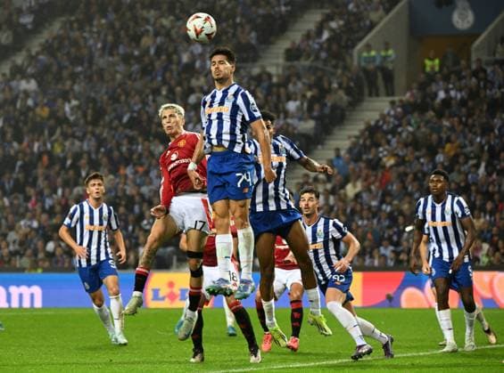 Thomas Myles of Manchester United, ManU and Alejandro Garnacho of Manchester United Porto v Manchester United, UEFA Europa League, Group Stage, Football, Estadio do Dragao, Porto, Portugal, 03 Oct 2024 EDITORIAL USE ONLY No use with unauthorised audio, video, data, fixture lists, club league logos or live services. Online in-match use limited to 120 images, no video emulation. No use in betting, games or single club league player publications. Copyright: xZedxJameson Shutterstockx 14750815fu
