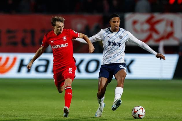 Youri Regeer of FC Twente and Jayden Oosterwolde of Fenerbahce battle for the ball , UEFA Europa League 2024 25 League Phase MD2, FC Twente v Fenerbahce SK, De Grolsch Veste, October 3, 2024, Enschede, Netherlands.