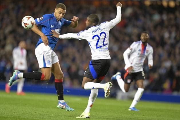 GLASGOW, SCOTLAND - OCTOBER 3: Clinton Mata of Olympique Lyon (R) fights for the ball with James Tavernier of Rangers FC (L) during the UEFA Europa League 2024 25 League Phase Matchday 2 match between Rangers FC and Olympique Lyonnais at Ibrox Stadium on October 03, 2024 in Glasgow, Scotland. FOOTBALL : Glasgow Rangers Vs Olympique Lyonnais - Ligue Europa - 03 10 2024 RichardCallis Panoramic 