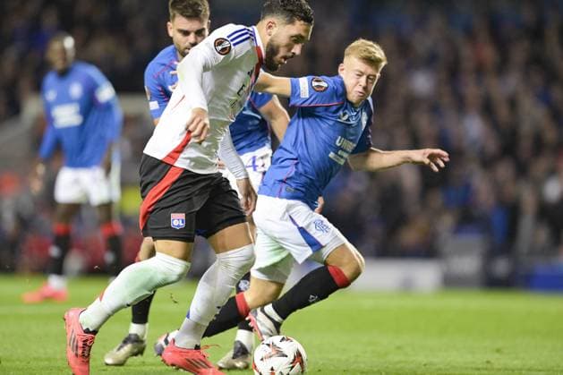 GLASGOW, SCOTLAND - OCTOBER 3: Rayan Cherki of Olympique Lyon (L) is chased by Connor Barron of Rangers FC (R) during the UEFA Europa League 2024 25 League Phase Matchday 2 match between Rangers FC and Olympique Lyonnais at Ibrox Stadium on October 03, 2024 in Glasgow, Scotland. FOOTBALL : Glasgow Rangers Vs Olympique Lyonnais - Ligue Europa - 03 10 2024 RichardCallis Panoramic 