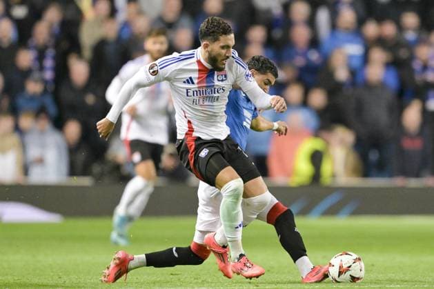 GLASGOW, SCOTLAND - OCTOBER 3: Rayan Cherki of Olympique Lyon (L) is challenged during the UEFA Europa League 2024 25 League Phase Matchday 2 match between Rangers FC and Olympique Lyonnais at Ibrox Stadium on October 03, 2024 in Glasgow, Scotland. FOOTBALL : Glasgow Rangers Vs Olympique Lyonnais - Ligue Europa - 03 10 2024 RichardCallis Panoramic 