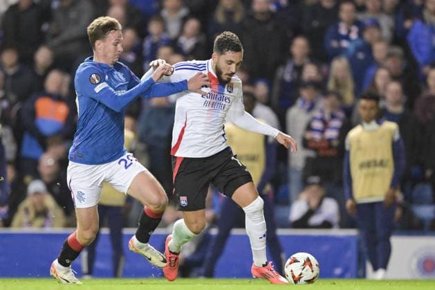 GLASGOW, SCOTLAND - OCTOBER 3: Rayan Cherki of Olympique Lyon (R) is challenged by Kieran Dowell of Rangers FC (L) during the UEFA Europa League 2024 25 League Phase Matchday 2 match between Rangers FC and Olympique Lyonnais at Ibrox Stadium on October 03, 2024 in Glasgow, Scotland. FOOTBALL : Glasgow Rangers Vs Olympique Lyonnais - Ligue Europa - 03 10 2024 RichardCallis Panoramic 