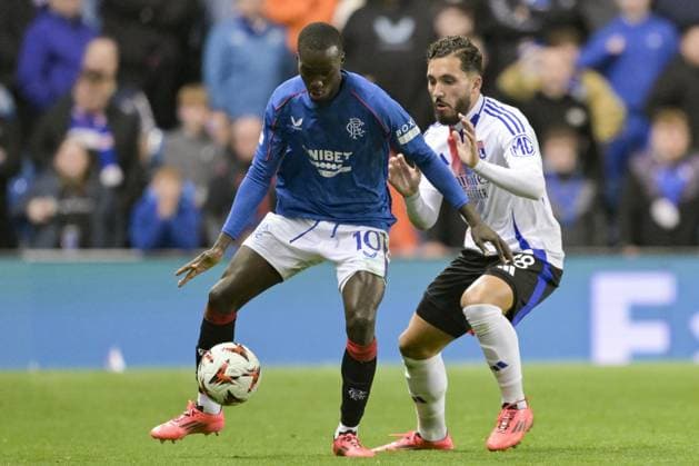 GLASGOW, SCOTLAND - OCTOBER 3: Mohamed Diomande of Rangers FC (L) is challenged by Rayan Cherki of Olympique Lyon (R) during the UEFA Europa League 2024 25 League Phase Matchday 2 match between Rangers FC and Olympique Lyonnais at Ibrox Stadium on October 03, 2024 in Glasgow, Scotland. FOOTBALL : Glasgow Rangers Vs Olympique Lyonnais - Ligue Europa - 03 10 2024 RichardCallis Panoramic 