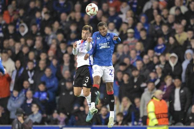 GLASGOW, SCOTLAND - OCTOBER 3: Dujon Sterling of Rangers FC (R) fights for heading the ball with Nicolas Tagliafico of Olympique Lyon (L) during the UEFA Europa League 2024 25 League Phase Matchday 2 match between Rangers FC and Olympique Lyonnais at Ibrox Stadium on October 03, 2024 in Glasgow, Scotland. FOOTBALL : Glasgow Rangers Vs Olympique Lyonnais - Ligue Europa - 03 10 2024 RichardCallis Panoramic 