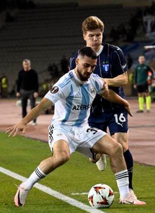 (241004) -- BAKU, Oct. 4, 2024 -- Abbas Huseynov (L) of Qarabag vies with Oliver Berg of Malmo during a UEFA Europa League match between Qarabag and Malmo in Baku, Azerbaijan, Oct. 3, 2024. (Photo by Tofik Babayev Xinhua) (SP)AZERBAIJAN-BAKU-FOOTBALL-UEFA EUROPA LEAGUE-QARABAG VS MALMO ZhongxZhong 