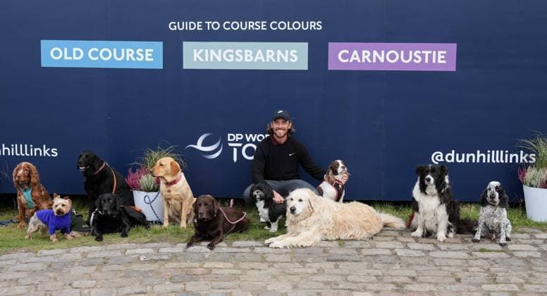 Tommy Fleetwood meets some dogs under the scoreboard after finishing his round at Kingsbarns. Alfred Dunhill Links Championship 2024, Day Two, Golf, Kingsbarns, Scotland, UK - 04 Oct 2024  Copyright: xStuartxWallace Shutterstockx 14751991cg