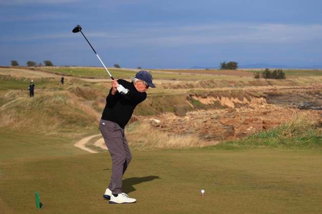 4th October 2024; Kingsbarns, Fife, Scotland; Alfred Dunhill Links Golf Championship, Round 2; Actor Michael Douglas tees off on the third hole on Kingsbarns Golf Links, during the second round of the Dunhill Links Championship  ActionPlus12699729 DavidxYoung