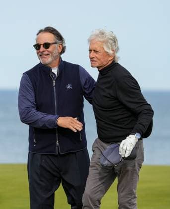 Michael Douglas embraces Andy Garcia on the 18th green as they finish their round at Kingsbarns. Alfred Dunhill Links Championship 2024, Day Two, Golf, Kingsbarns, Scotland, UK - 04 Oct 2024  Copyright: xStuartxWallace Shutterstockx 14751991dz
