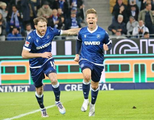 04 10 2024, xmohx, Soccer 2 Bundesliga, Karlsruher SC SV Darmstadt 98 emspor, v l Budu Zivzivadze and Dzenis Burnic karslruhe celebrate the 1 0 DFL DFB REGULATIONS PROHIBIT ANY USE OF PHOTOGRAPHS as IMAGE SEQUENCES and or QUASI VIDEO Karlsruhe
