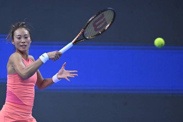(241005) -- BEIJING, Oct. 5, 2024 -- Zheng Qinwen of China competes during the women s singles semifinal match against Karolina Muchova of the Czech Republic at 2024 China Open tennis tournament in Beijing, capital of China, Oct. 5, 2024. ) (SP)CHINA-BEIJING-TENNIS-CHINA OPEN-WOMEN S SINGLES(CN) ZhangxLong 