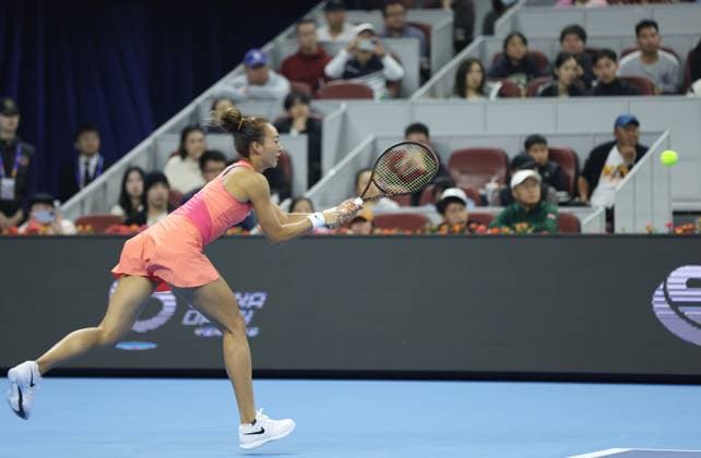 (241005) -- BEIJING, Oct. 5, 2024 -- Zheng Qinwen of China competes during the women s singles semifinal match against Karolina Muchova of the Czech Republic at 2024 China Open tennis tournament in Beijing, capital of China, Oct. 5, 2024. (Photo by Xinhua) (SP)CHINA-BEIJING-TENNIS-CHINA OPEN-WOMEN S SINGLES(CN) DuxXinyi 