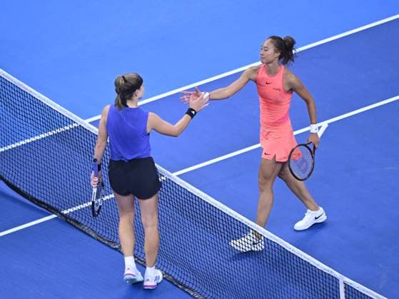 (241005) -- BEIJING, Oct. 5, 2024 -- Zheng Qinwen (R) greets Karolina Muchova after the women s singles semifinal match between Zheng Qinwen of China and Karolina Muchova of the Czech Republic at 2024 China Open tennis tournament in Beijing, capital of China, Oct. 5, 2024. ) (SP)CHINA-BEIJING-TENNIS-CHINA OPEN-WOMEN S SINGLES(CN) ZhangxLong 