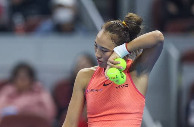 (241005) -- BEIJING, Oct. 5, 2024 -- Zheng Qinwen reacts during the women s singles semifinal match between Zheng Qinwen of China and Karolina Muchova of the Czech Republic at 2024 China Open tennis tournament in Beijing, capital of China, Oct. 5, 2024. ) (SP)CHINA-BEIJING-TENNIS-CHINA OPEN-WOMEN S SINGLES(CN) BaixXuefei 