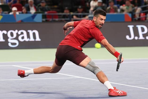 (241005) -- SHANGHAI, Oct. 5, 2024 -- Novak Djokovic hits a return during the men s singles round of 64 match between Alex Michelsen of the United States and Novak Djokovic of Serbia at the ATP, Tennis Herren World Tour Shanghai Masters tennis tournament in Shanghai, east China, Oct. 5, 2024. ) (SP)CHINA-SHANGHAI-TENNIS-ATP TOUR-SHANGHAI MASTERS(CN) WangxXiang 