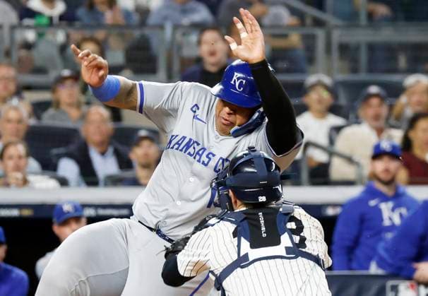 New York Yankees Austin Wells takes out Kansas City Royals Salvador Perez at home plate in the second inning in game one of the ALDS at Yankee Stadium on Saturday, October 5, 2024 in New York City.  NYP20241005107 JOHNxANGELILLO