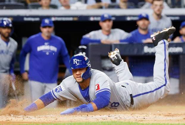 Kansas City Royals Yuli Gurriel scores on a sac fly in the 2nd inning against the New York Yankees in game one of the ALDS at Yankee Stadium on Saturday, October 5, 2024 in New York City.  NYP20241005109 JOHNxANGELILLO