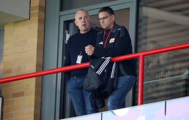 President Dirk Zingler talks to chief scout Oliver Ruhnert in the stands Sport Football Soccer Bundesliga Men DFL 6 Matchday Season 2024 2025 05 10 2024 1 FC Union Berlin FCU vs BVB Borussia Dortmund DFL regulations prohibit any use of photographs as image sequences and or quasi video