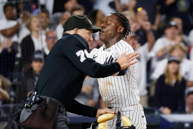 New York Yankees Jazz Chisholm Jr. runs into home plate umpire Adam Hamari after scoring a run in the 7th inning against Kansas City Royals in game one of the ALDS at Yankee Stadium on Saturday, October 5, 2024 in New York City. The Yankees defeated the Royals 6-5 and lead the best of 5 series 1-0.  NYP202410051261 JOHNxANGELILLO