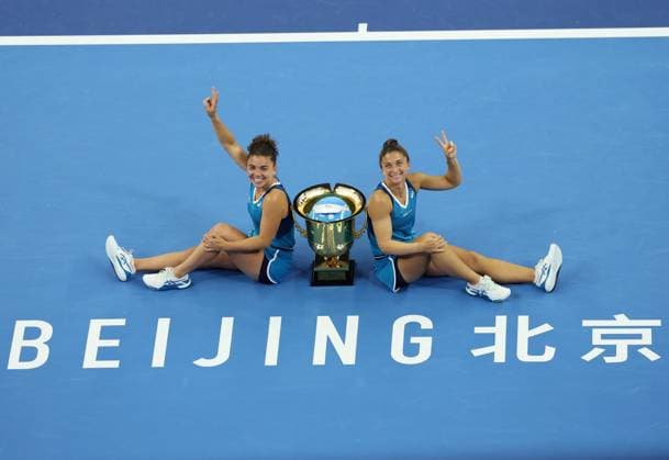 (241006) -- BEIJING, Oct. 6, 2024 -- Winners Sara Errani (R) Jasmine Paolini of Italy celebrate with the trophy after winning the women s doubles final against Chan Hao-Ching of Chinese Taipei Veronica Kudermetova of Russia at the 2024 China Open tennis tournament in Beijing, China, Oct. 6, 2024. ) (SP)CHINA-BEIJING-TENNIS-CHINA OPEN-WOMEN S DOUBLES-FINAL (CN) ZhangxChenlin 
