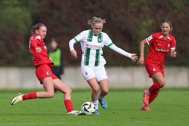 Weena Simmen SC Freiburg U20 and Mia Eickmann Borussia Mönchengladbach battle for the ball during the 2 Frauen Bundesliga match between Borussia Mönchengladbach and SC Freiburg, Grenzlandstadion on October 06, 2024 in Mönchengladbach, Germany Photo by Oliver Kaelke DeFodi Images Weena Simmen SC Freiburg U20 and Mia Eickmann Borussia Mönchengladbach battle for the ball during the 2 Frauen Bundesliga match between Borussia Mönchengladbach and SC Freiburg at Grenzlandstadium on October 6, 2024 in Mönchengladbach, Germany Photo by Oliver Kaelke DeFodi Images DFL regulations prohibit any use of photographs as image sequences and or quasi video Defodi 003 678 2024 10 06 OK BMGSCF 0234 Defodi-003 DFL regulations prohibit any use of photographs as image sequences and or quasi-video.