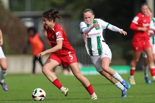 Leonie Lorenz SC Freiburg U20 and Mia Eickmann Borussia Mönchengladbach battle for the ball during the 2 Frauen Bundesliga match between Borussia Mönchengladbach and SC Freiburg, Grenzlandstadion on October 06, 2024 in Mönchengladbach, Germany Photo by Oliver Kaelke DeFodi Images Leonie Lorenz SC Freiburg U20 and Mia Eickmann Borussia Mönchengladbach battle for the ball during the 2 Frauen Bundesliga match between Borussia Mönchengladbach and SC Freiburg at Grenzlandstadium on October 6, 2024 in Mönchengladbach, Germany Photo by Oliver Kaelke DeFodi Images DFL regulations prohibit any use of photographs as image sequences and or quasi video Defodi 003 678 2024 10 06 OK BMGSCF 0444 Defodi-003 DFL regulations prohibit any use of photographs as image sequences and or quasi-video.