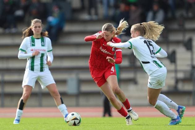 Mia Lena Maas SC Freiburg U20 and Sam Drissen Borussia Mönchengladbach battle for the ball during the 2 Frauen Bundesliga match between Borussia Mönchengladbach and SC Freiburg, Grenzlandstadion on October 06, 2024 in Mönchengladbach, Germany Photo by Oliver Kaelke DeFodi Images Mia Lena Maas SC Freiburg U20 and Sam Drissen Borussia Mönchengladbach battle for the ball during the 2 Frauen Bundesliga match between Borussia Mönchengladbach and SC Freiburg at Grenzlandstadium on October 6, 2024 in Mönchengladbach, Germany Photo by Oliver Kaelke DeFodi Images DFL regulations prohibit any use of photographs as image sequences and or quasi video Defodi 003 678 2024 10 06 OK BMGSCF 1319 Defodi-003 DFL regulations prohibit any use of photographs as image sequences and or quasi-video.