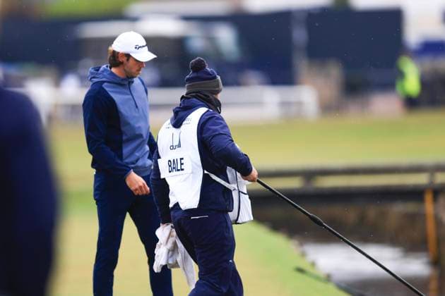 6th October 2024; The Old Course at St Andrews, Fife, Scotland; Alfred Dunhill Links Golf Championship, Final Round; Welsh former footballer Gareth Bale caddie retrieves his ball from the Swilken burn on the first hole of the Old Course, St Andrews, during the final round of the Dunhill Links Championship  ActionPlus12701440 DavidxYoung