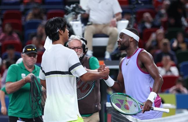 (241007) -- SHANGHAI, Oct. 7, 2024 -- Zhou Yi of China and Frances Tiafoe (R) of the United States shake hands after their men s singles round of 64 match at the ATP, Tennis Herren World Tour Shanghai Masters tennis tournament in Shanghai, east China, Oct. 7, 2024. ) (SP)CHINA-SHANGHAI-TENNIS-ATP TOUR-SHANGHAI MASTERS(CN) BaixXuefei 