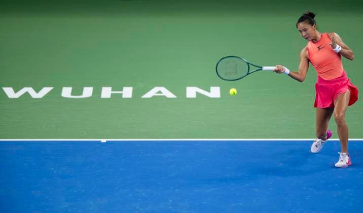 (241007) -- WUHAN, Oct. 7, 2024 -- Yuan Yue of China hits a return during the women s singles round of 64 match against Clara Burel of France at the 2024 Wuhan Open tennis tournament in Wuhan, capital of central China s Hubei Province, Oct. 7, 2024. ) (SP)CHINA-WUHAN-TENNIS-WUHAN OPEN-WOMEN S SINGLES (CN) WuxZhizun 