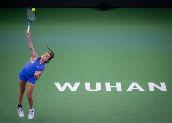 (241007) -- WUHAN, Oct. 7, 2024 -- Clara Burel of France serves during the women s singles round of 64 match against Yuan Yue of China at the 2024 Wuhan Open tennis tournament in Wuhan, capital of central China s Hubei Province, Oct. 7, 2024. ) (SP)CHINA-WUHAN-TENNIS-WUHAN OPEN-WOMEN S SINGLES (CN) HuxJingwen 
