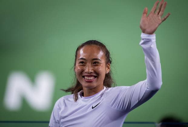 (241007) -- WUHAN, Oct. 7, 2024 -- Chinese tennis player Zheng Qinwen greets spectators during the opening ceremony of the 2024 Wuhan Open tennis tournament in Wuhan, capital of central China s Hubei Province, Oct. 7, 2024. ) (SP)CHINA-WUHAN-TENNIS-WUHAN OPEN-OPENING CEREMONY (CN) HuxJingwen 