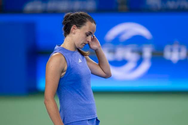 (241007) -- WUHAN, Oct. 7, 2024 -- Clara Burel of France reacts during the women s singles round of 64 match against Yuan Yue of China at the 2024 Wuhan Open tennis tournament in Wuhan, capital of central China s Hubei Province, Oct. 7, 2024. ) (SP)CHINA-WUHAN-TENNIS-WUHAN OPEN-WOMEN S SINGLES (CN) WuxZhizun 