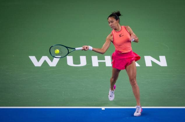 (241007) -- WUHAN, Oct. 7, 2024 -- Yuan Yue of China hits a return during the women s singles round of 64 match against Clara Burel of France at the 2024 Wuhan Open tennis tournament in Wuhan, capital of central China s Hubei Province, Oct. 7, 2024. ) (SP)CHINA-WUHAN-TENNIS-WUHAN OPEN-WOMEN S SINGLES (CN) HuxJingwen 